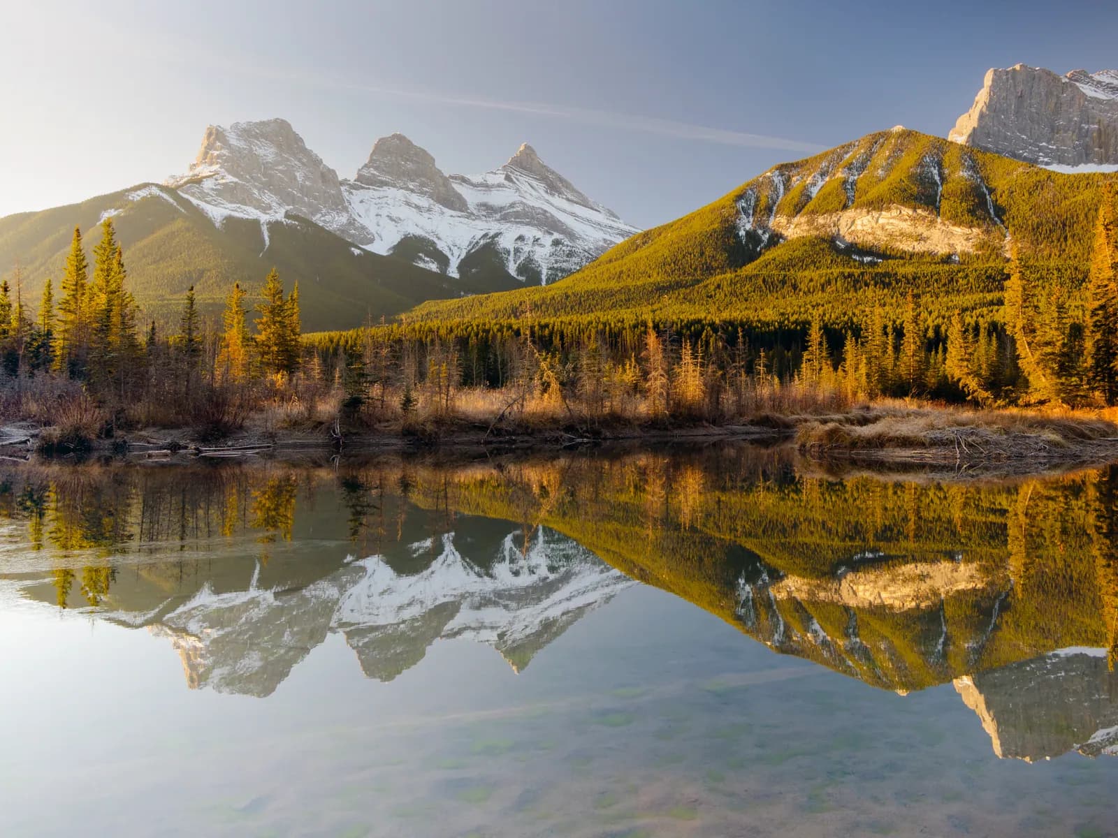 Canmore, AB — Three Sisters reflected in Policeman Creek