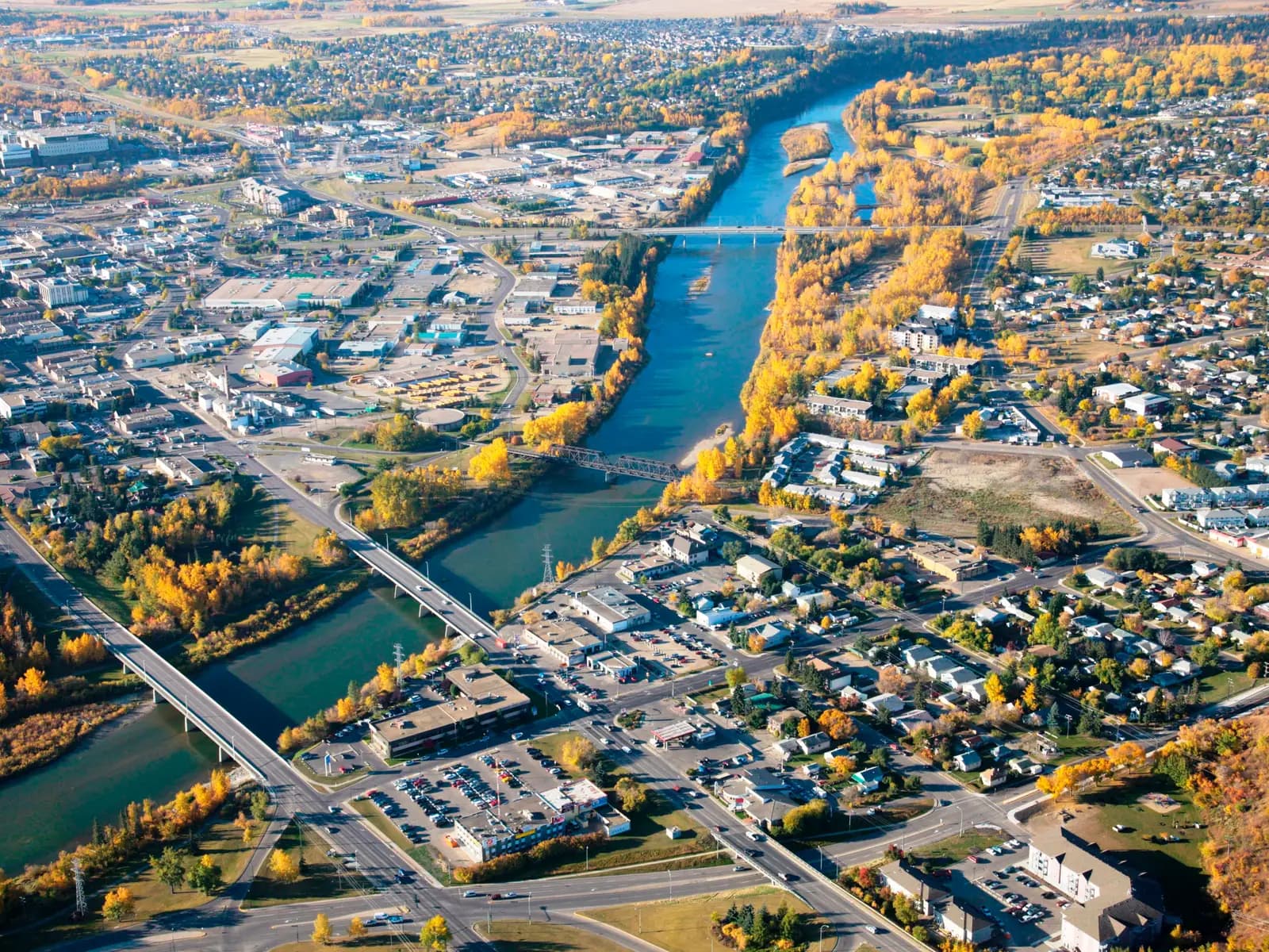 Red Deer, AB — aerial view of the Red Deer River and downtown bridges